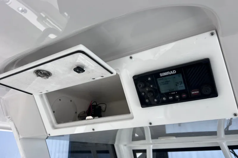 Slide: The Image of 2022 Sea Pro 320 DLX Offshore boat dashboard with Simrad marine electronics. - 83