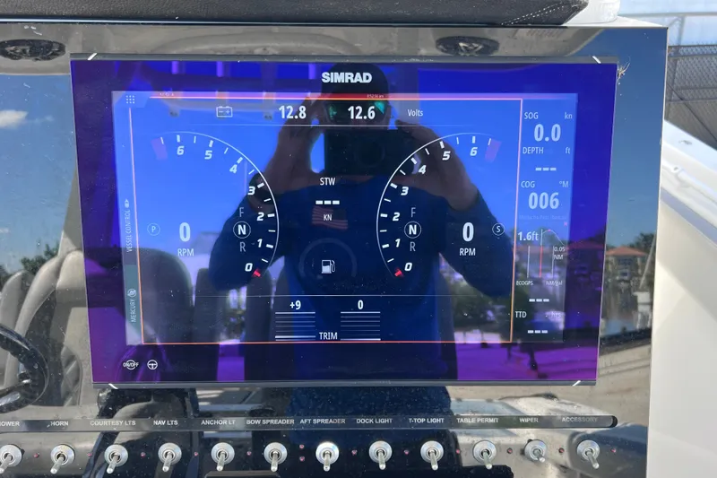 Slide: The Image of Simrad display on 2022 Sea Pro 320 DLX Offshore boat dashboard. - 56