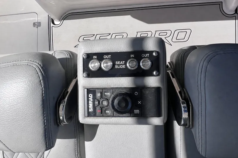 Slide: The Image of Control panel on 2022 Sea Pro 320 DLX Offshore boat with seat slide and Simrad system. - 51