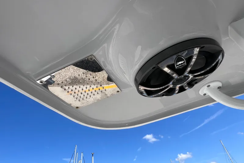 Slide: The Image of 2022 Sea Pro 320 DLX Offshore boat speaker and mirror under clear blue sky. - 80