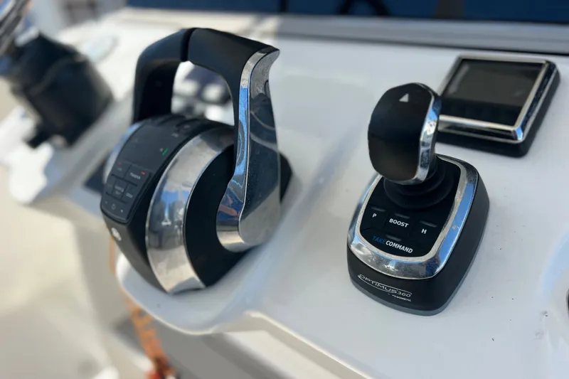 Slide: The Image of Close-up of 2022 Sea Pro 320 DLX Offshore boat controls and joystick. - 63