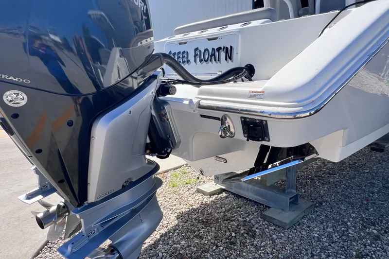 Slide: The Image of 2022 Sea Pro 320 DLX Offshore boat with powerful outboard motor on display. - 26