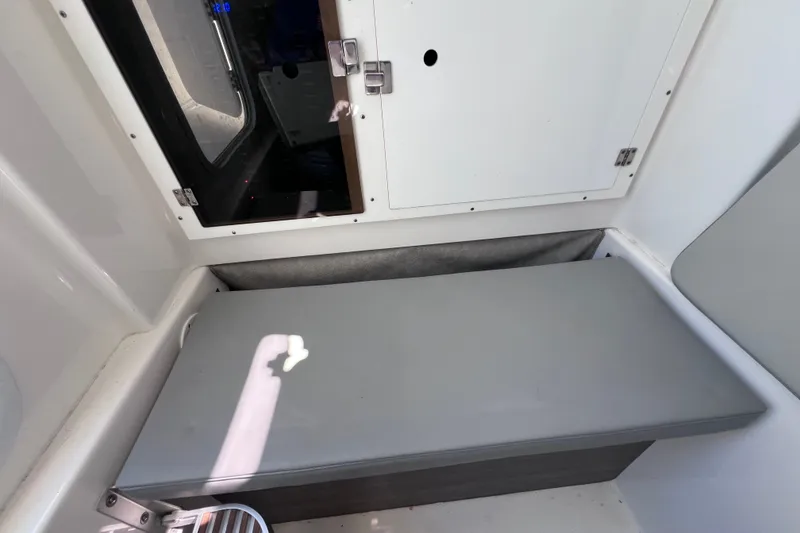 Slide: The Image of Interior cabin of 2022 Sea Pro 320 DLX Offshore boat with cushioned seating. - 91