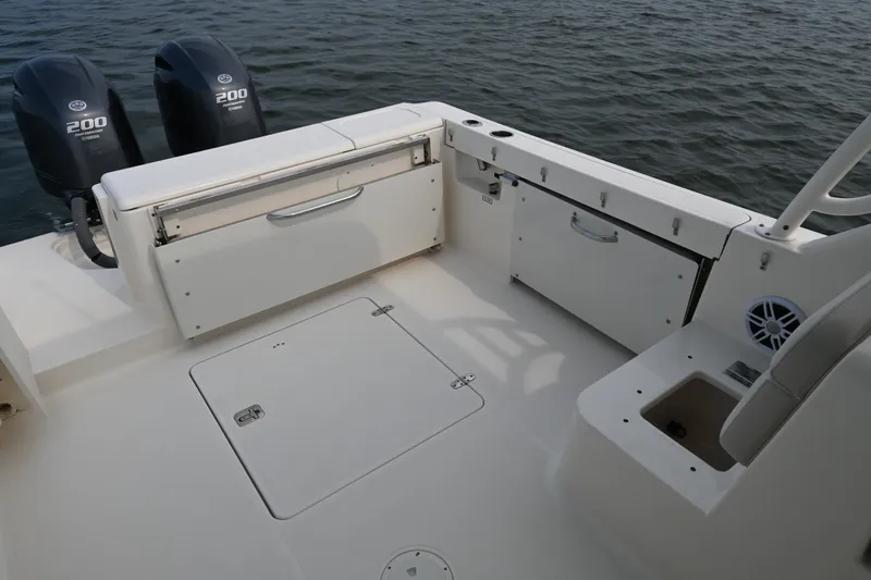 Slide: The Image of 2014 Pursuit DC 265 Dual Console boat deck with Yamaha 200 engines. - 26