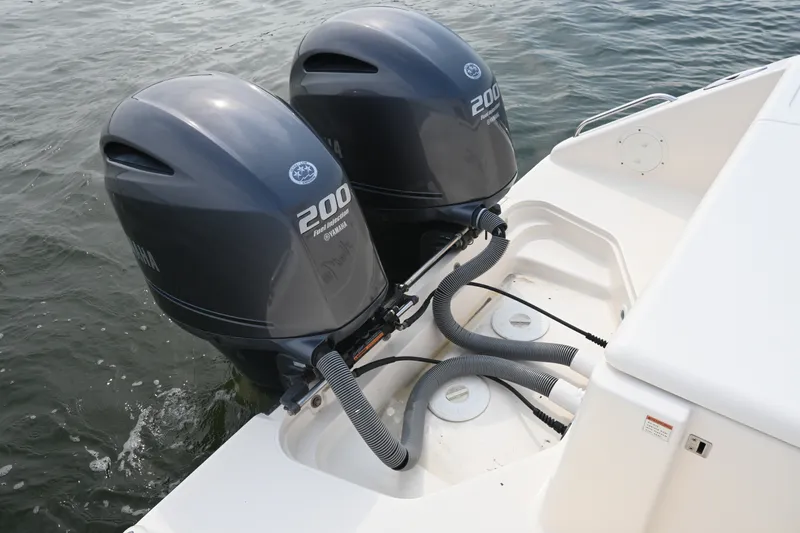 Slide: The Image of Twin Yamaha 200 outboard engines on a 2014 Pursuit DC 265 Dual Console boat. - 32