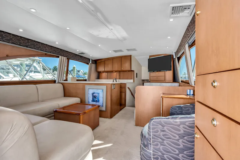 Slide: The Image of Interior of a 2007 Ocean Yachts 46 Super Sport with elegant wood furnishings and comfortable seating. - 47
