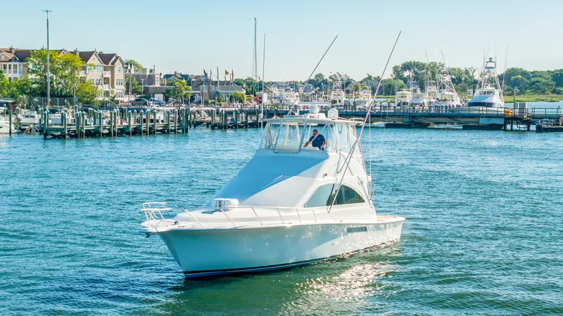 Slide: The Image of A 2007 Ocean Yachts 46 Super Sport cruising through a busy harbor with numerous boats. - 29