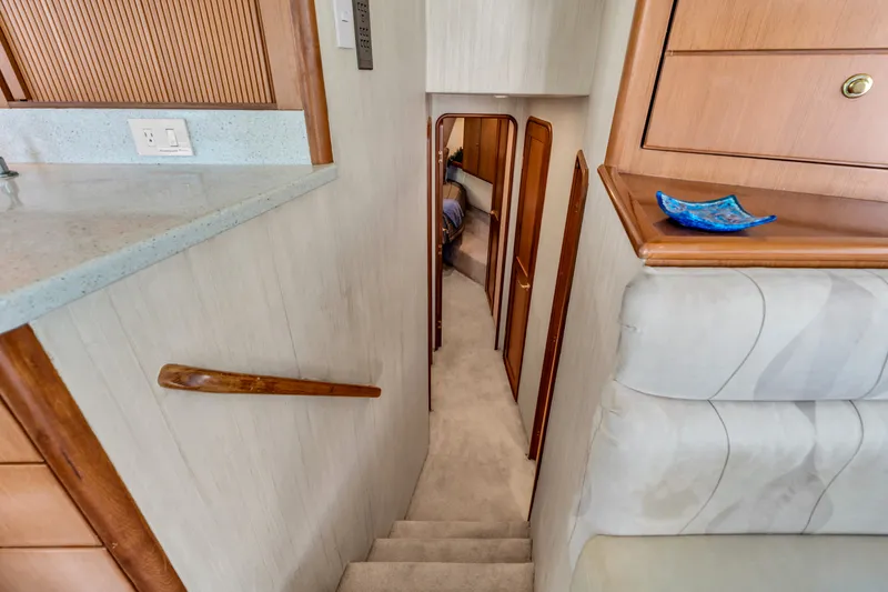 Slide: The Image of Interior of a 2007 Ocean Yachts 46 Super Sport with stairs and wooden cabinetry. - 46