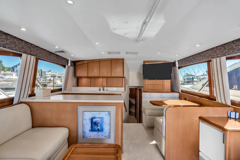 Slide: The Image of Interior of a 2007 Ocean Yachts 46 Super Sport with elegant furnishings and large windows. - 49