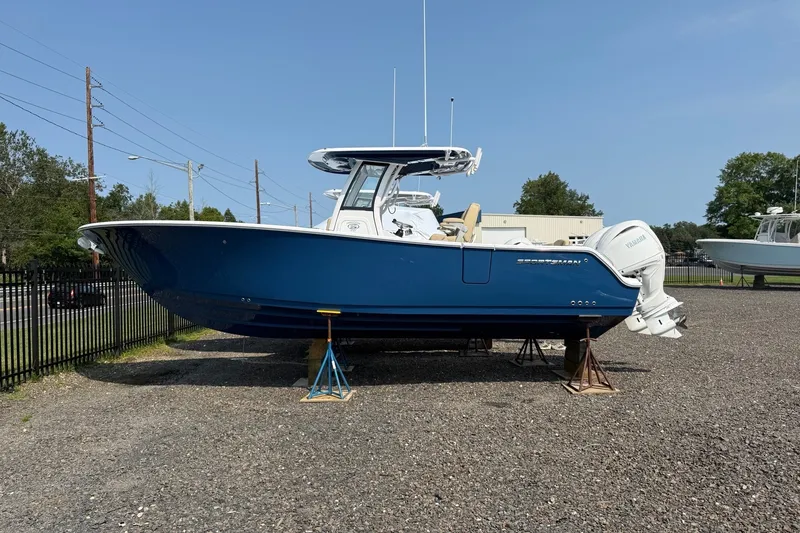 The Image of 2027 Sportsman Heritage 261 Center Console boat on display outdoors. - 0