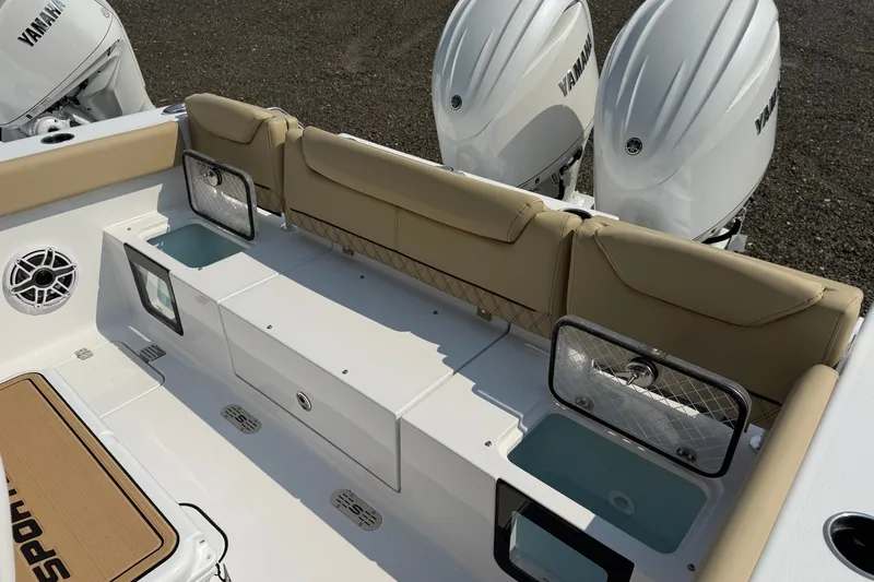 Slide: The Image of 2027 Sportsman Heritage 261 Center Console boat interior with Yamaha engines and seating. - 14