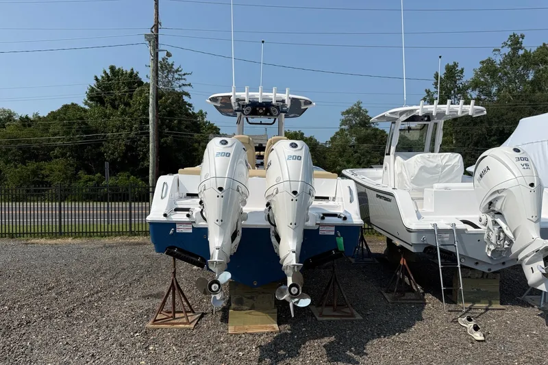 Slide: The Image of 2027 Sportsman Heritage 261 Center Console boats with Yamaha engines on display. - 16