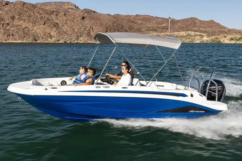 The Image of Manufacturer Provided Image: 2026 Hurricane SunDeck Sport 185 OB boat cruising on a lake with passengers. - 0