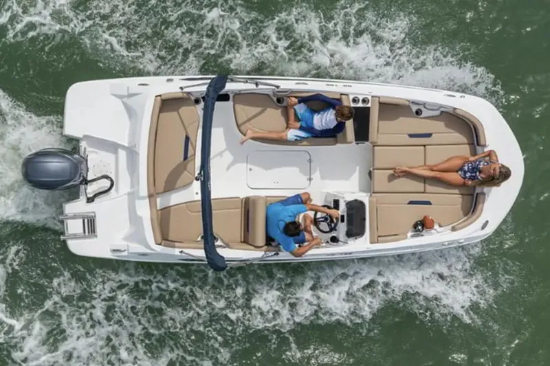 Slide: The Image of Manufacturer Provided Image: 2026 Hurricane SunDeck Sport 185 OB boat cruising with passengers on a sunny day. - 3