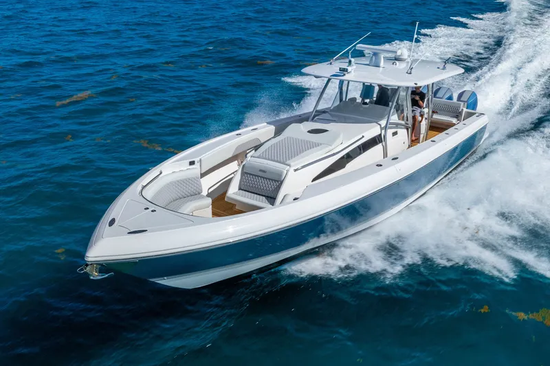 Slide: The Image of 2015 Intrepid 475 Panacea cruising on open blue water. - 7