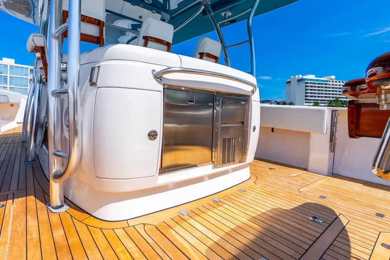 Slide: The Image of 2015 Intrepid 475 Panacea yacht deck with sleek design and modern amenities. - 26