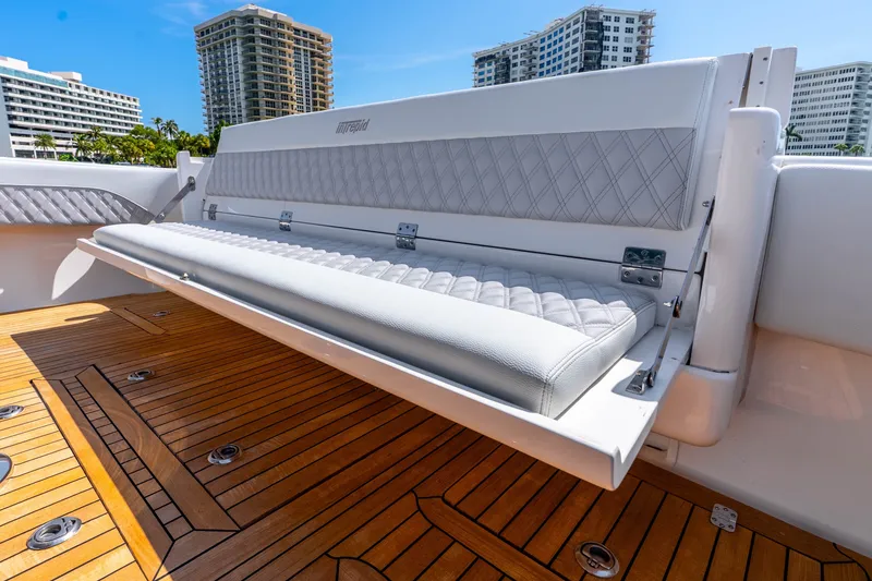 Slide: The Image of 2015 Intrepid 475 Panacea boat with luxurious seating and teak flooring. - 25