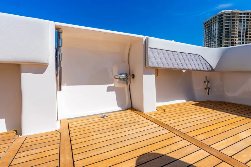 Slide: The Image of 2015 Intrepid 475 Panacea boat deck with wooden flooring and modern design. - 29