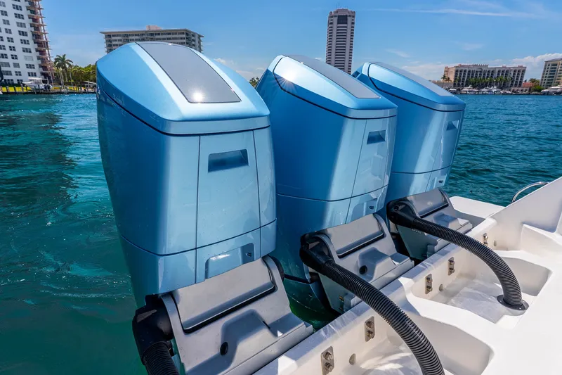 Slide: The Image of Triple outboard motors on a 2015 Intrepid 475 Panacea boat in a marina. - 32
