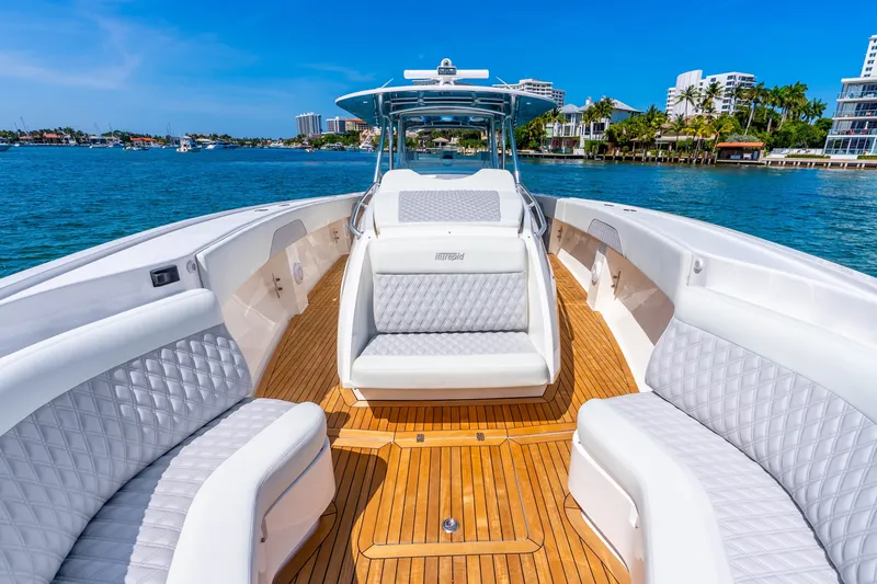Slide: The Image of Luxurious 2015 Intrepid 475 Panacea boat with elegant seating and teak deck on a sunny day. - 10