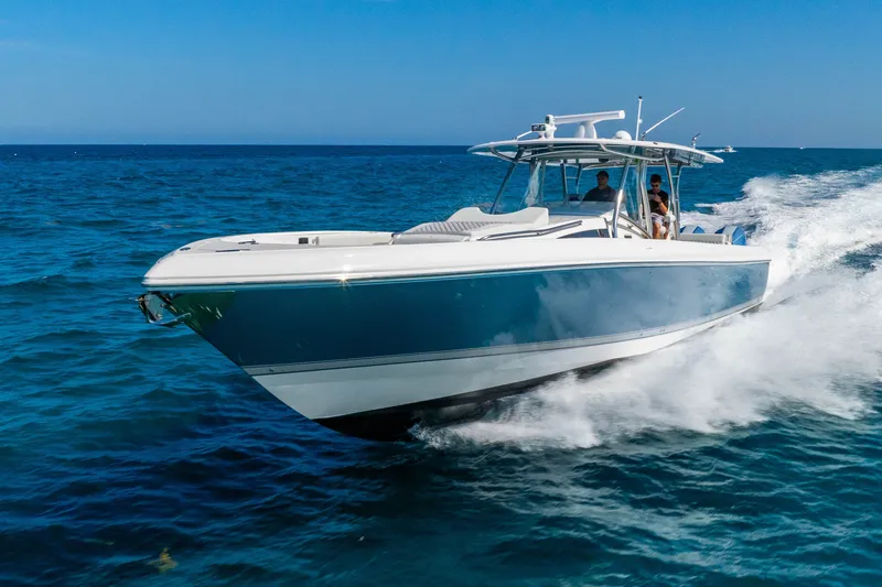 Slide: The Image of 2015 Intrepid 475 Panacea cruising on open blue ocean waters. - 9