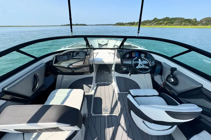 Slide: The Image of 2023 Monterey 235SS Super Sport boat interior with sleek design and modern dashboard. - 17