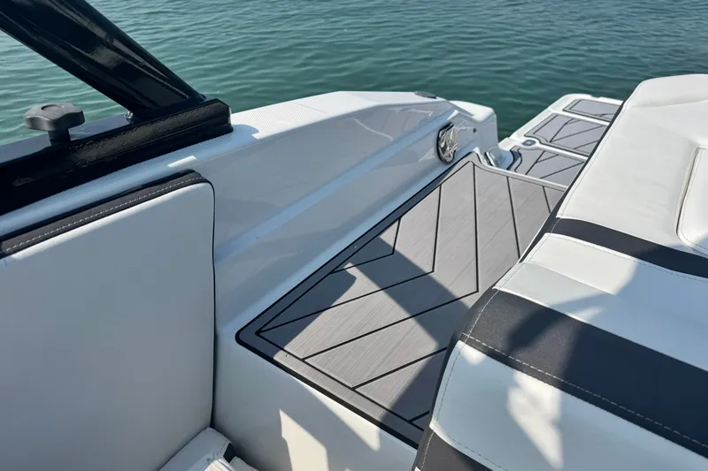 Slide: The Image of 2023 Monterey 235SS Super Sport boat interior with sleek seating and deck design. - 12