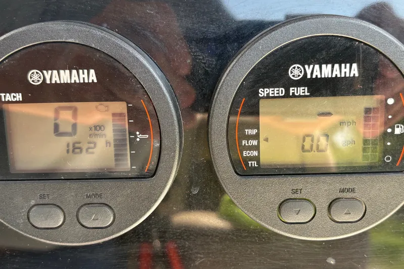 Slide: The Image of Yamaha boat gauges displaying tachometer and speed fuel readings on a 2019 Tidewater 2200 Carolina Bay. - 25