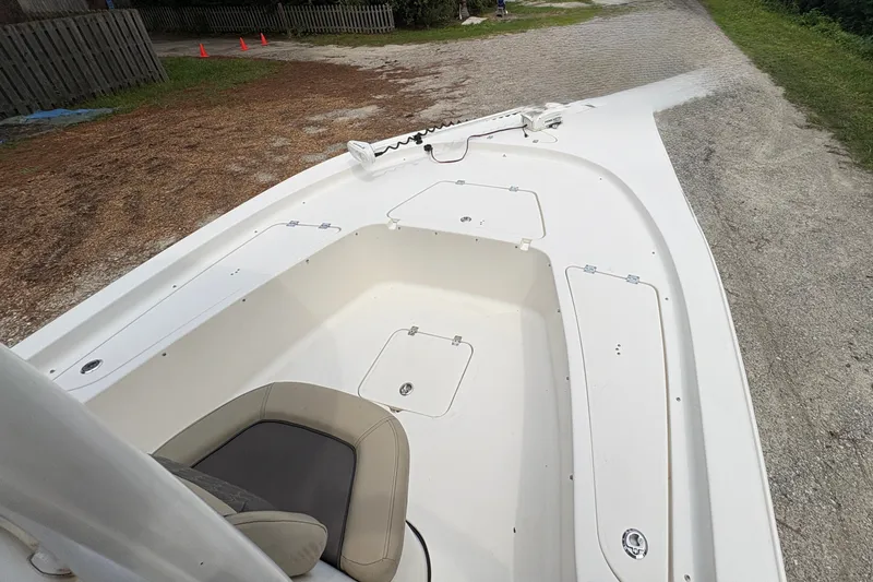 Slide: The Image of 2019 Tidewater 2200 Carolina Bay boat deck with seating and storage compartments. - 35