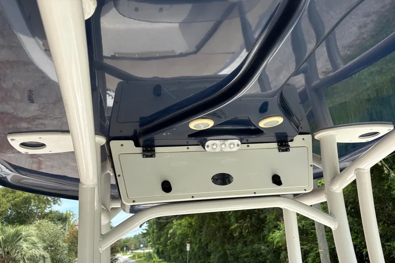 Slide: The Image of T-Top of 2019 Tidewater 2200 Carolina Bay boat with mounted electronics and speakers. - 31