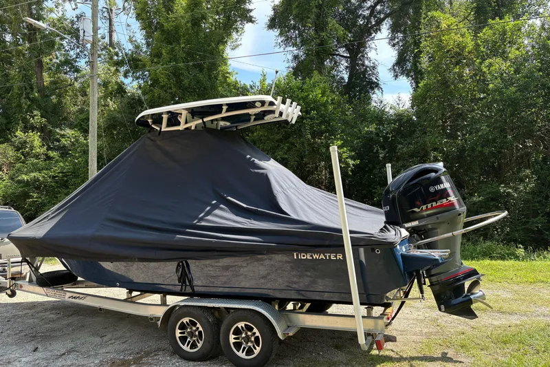 Slide: The Image of 2019 Tidewater 2200 Carolina Bay boat on trailer, covered, with Yamaha outboard motor. - 47