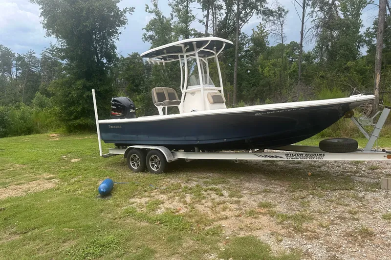 The Image of 2020 Tidewater 2200 Carolina Bay boat on trailer, parked on grassy area. - 0