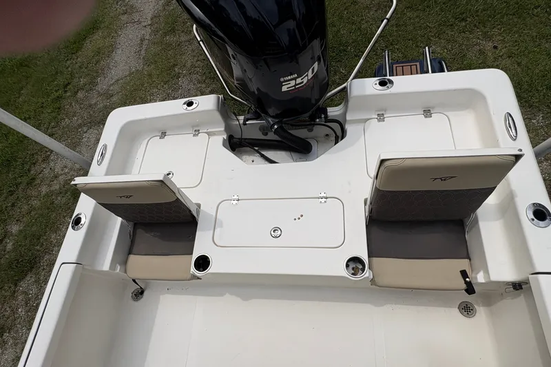 Slide: The Image of 2019 Tidewater 2200 Carolina Bay boat with Yamaha 250 engine, featuring rear seating and storage. - 36