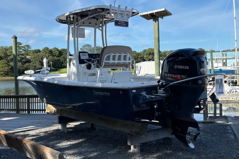 Slide: The Image of 2019 Tidewater 2200 Carolina Bay boat with Yamaha VMAX engine docked by the water. - 10