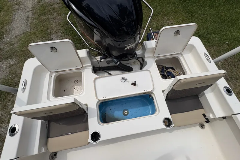 Slide: The Image of 2019 Tidewater 2200 Carolina Bay boat with open storage compartments and seating. - 37