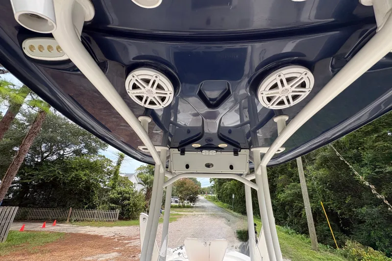 Slide: The Image of 2019 Tidewater 2200 Carolina Bay boat with speakers and canopy, viewed from below. - 38