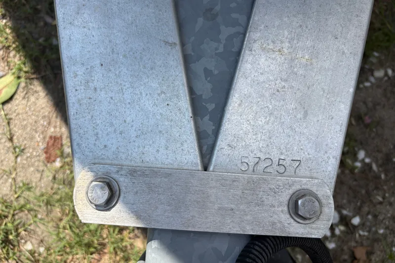 Slide: The Image of Close-up of a metal bracket with bolts and the number 57257, on a 2019 Tidewater 2200 Carolina Bay. - 42