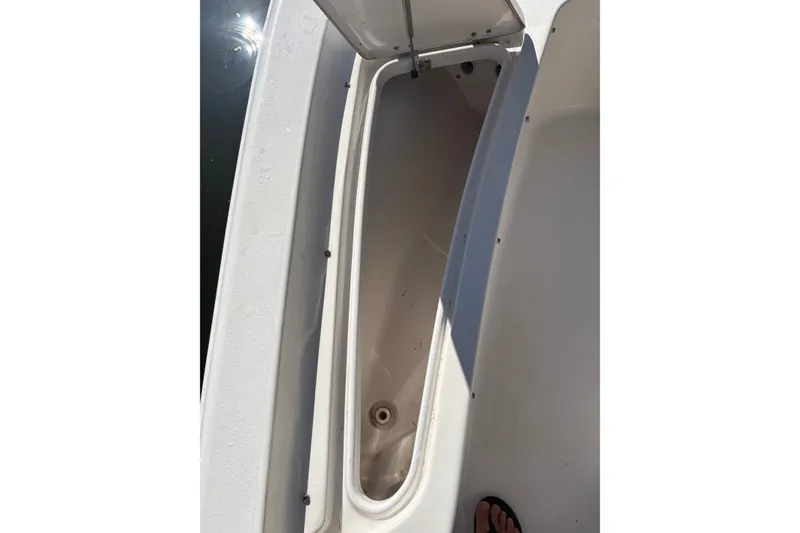 Slide: The Image of Open storage compartment on 2019 Tidewater 2200 Carolina Bay boat. - 46