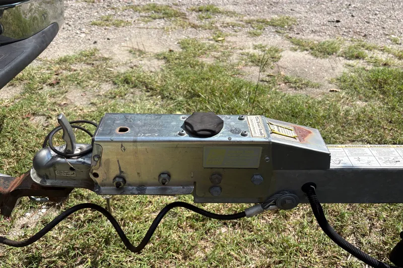 Slide: The Image of Trailer hitch of a 2019 Tidewater 2200 Carolina Bay boat on grass. - 41
