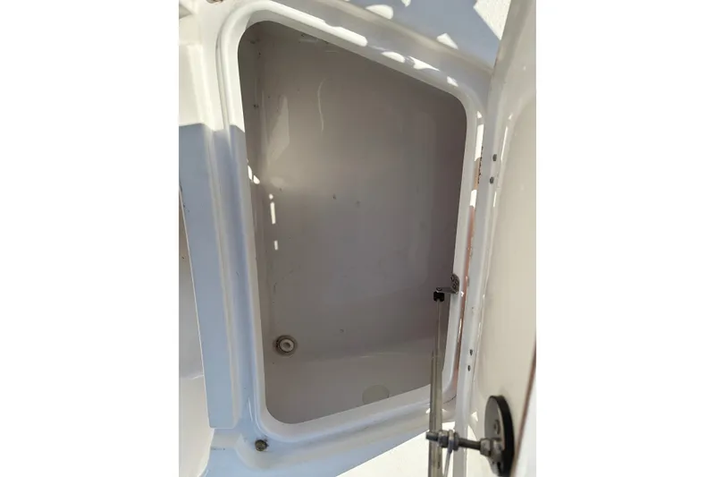 Slide: The Image of Open storage compartment on 2019 Tidewater 2200 Carolina Bay boat. - 47