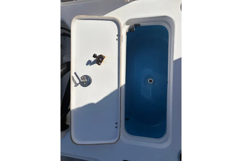 Slide: The Image of Open storage compartment on a 2019 Tidewater 2200 Carolina Bay boat. - 42