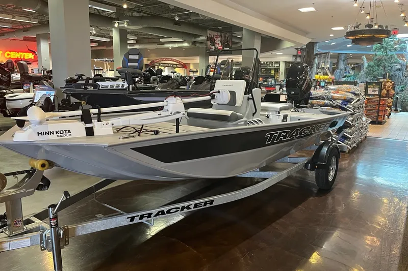 The Image of 2027 Tracker Bass Tracker Classic CC boat displayed in showroom with Minn Kota Maxxum motor. - 0