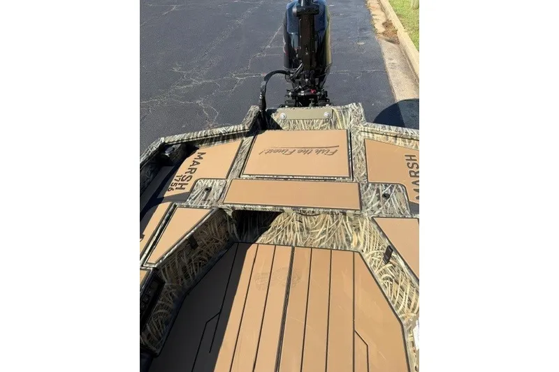 Slide: The Image of 2027 Tracker Grizzly 1756 T Marsh boat with camouflage design and outboard motor. - 16
