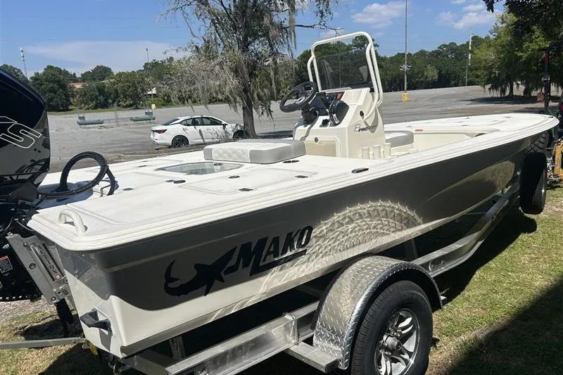 Slide: The Image of 2026 Mako 18 Pro Skiff boat on trailer in outdoor setting. - 5