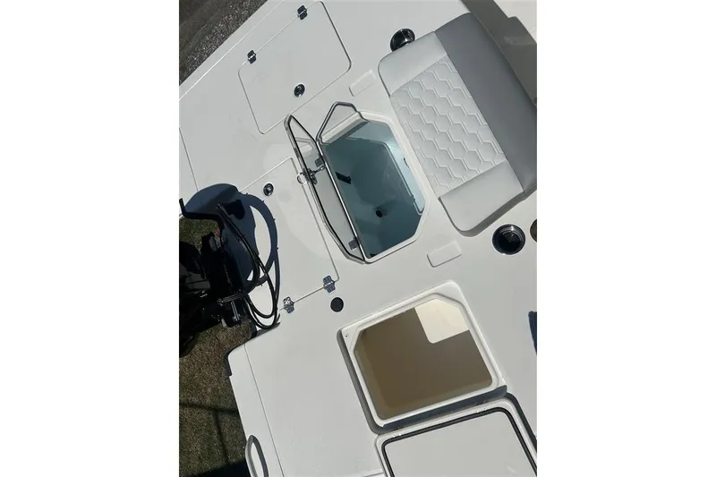 Slide: The Image of Top view of 2026 Mako 18 Pro Skiff boat interior with seating and storage compartments. - 6