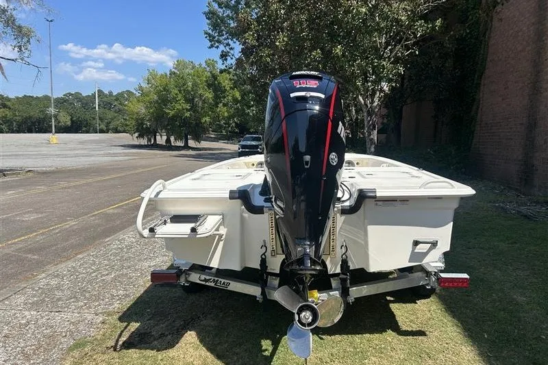 Slide: The Image of 2026 Mako 18 Pro Skiff boat with Mercury outboard motor on trailer. - 7