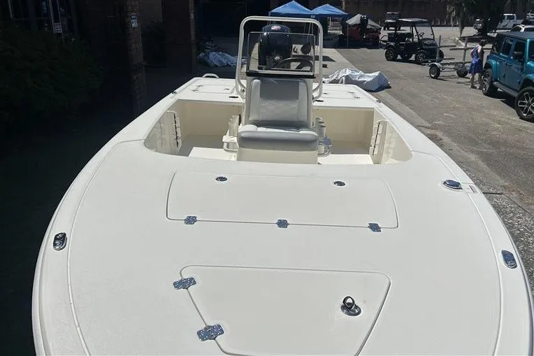 Slide: The Image of 2026 Mako 18 Pro Skiff boat with spacious deck and center console. - 8