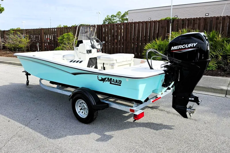 Slide: The Image of 2026 Mako Pro Skiff 15 CC boat with Mercury engine on trailer. - 13