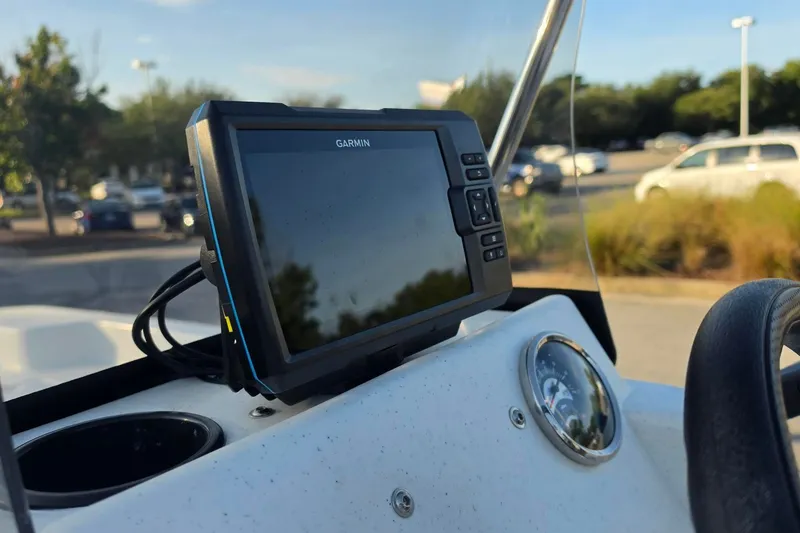 Slide: The Image of Garmin GPS on 2026 Mako Pro Skiff 15 CC boat dashboard in parking lot. - 18