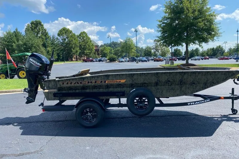 The Image of 2027 Tracker Grizzly 1756 T Marsh boat on trailer in parking lot. - 0